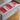 Bulk box of The Fix coffee drip bags featuring red and silver individual sachets inside a white branded cardboard box.