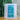 Artisti Coffee Roasters Champion single-serve drip bag in a white pouch with a teal label on a wooden table.