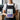 Person holding a 500g white bag of Placebo decaf coffee beans with a purple label and blue geometric pattern.