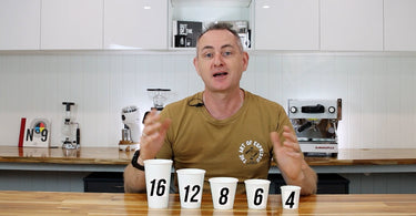 Luke at Artisti Coffee Roasters teaching baristas how much espresso should be put into each of the various cup sizes. 