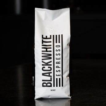 A picture of a 1kg bag of Blackwhite Espresso coffee beans.